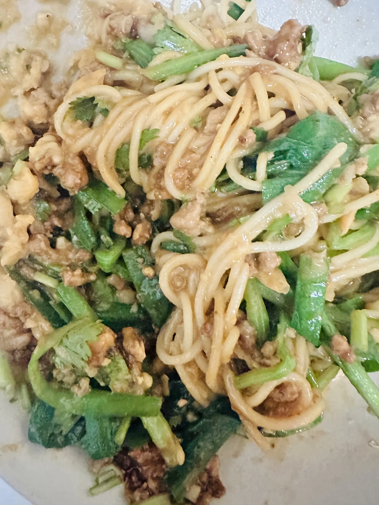Stirring the assembled noodle bowl