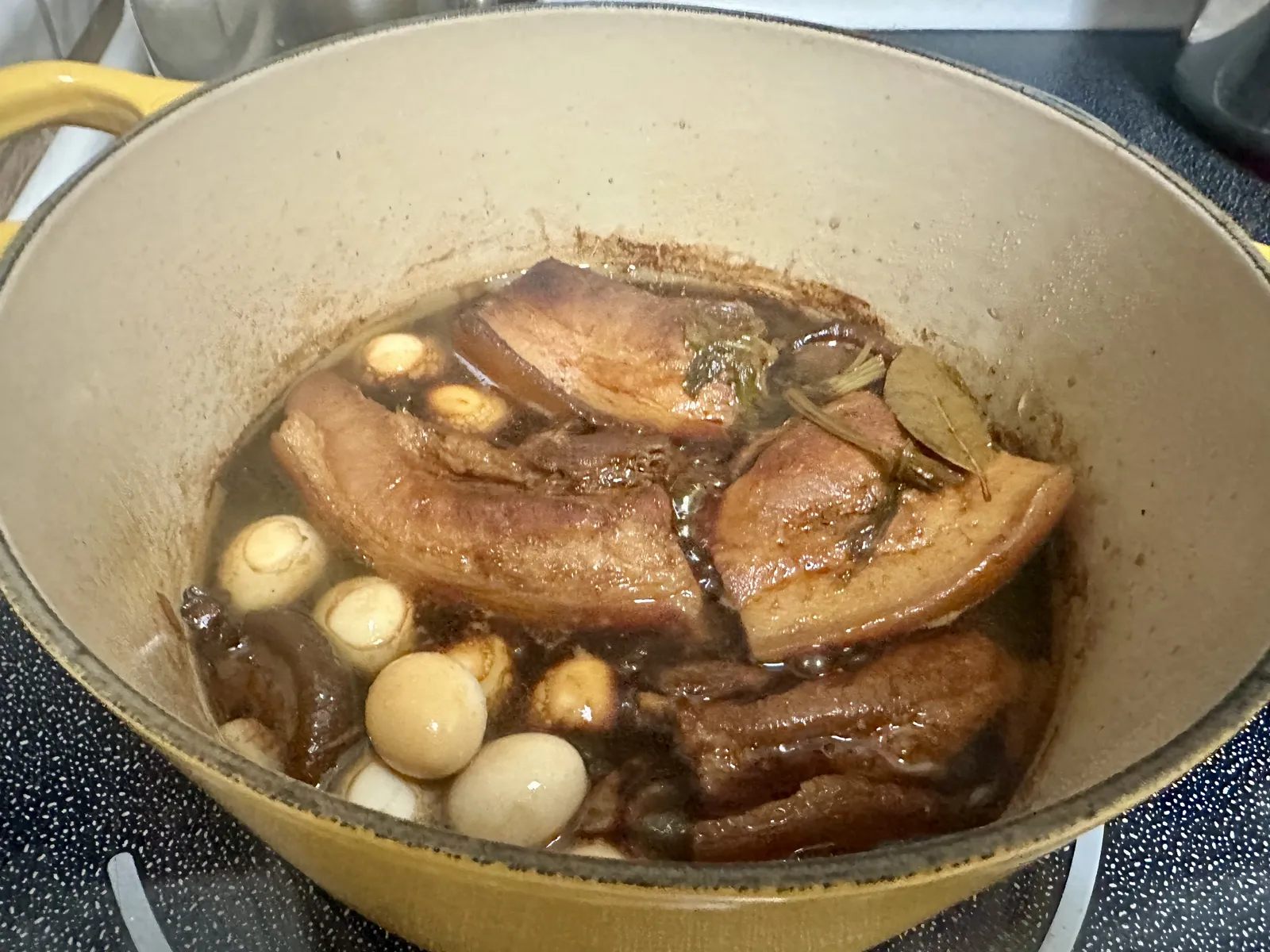 Close-up of the reduced braising sauce clinging to the pork belly