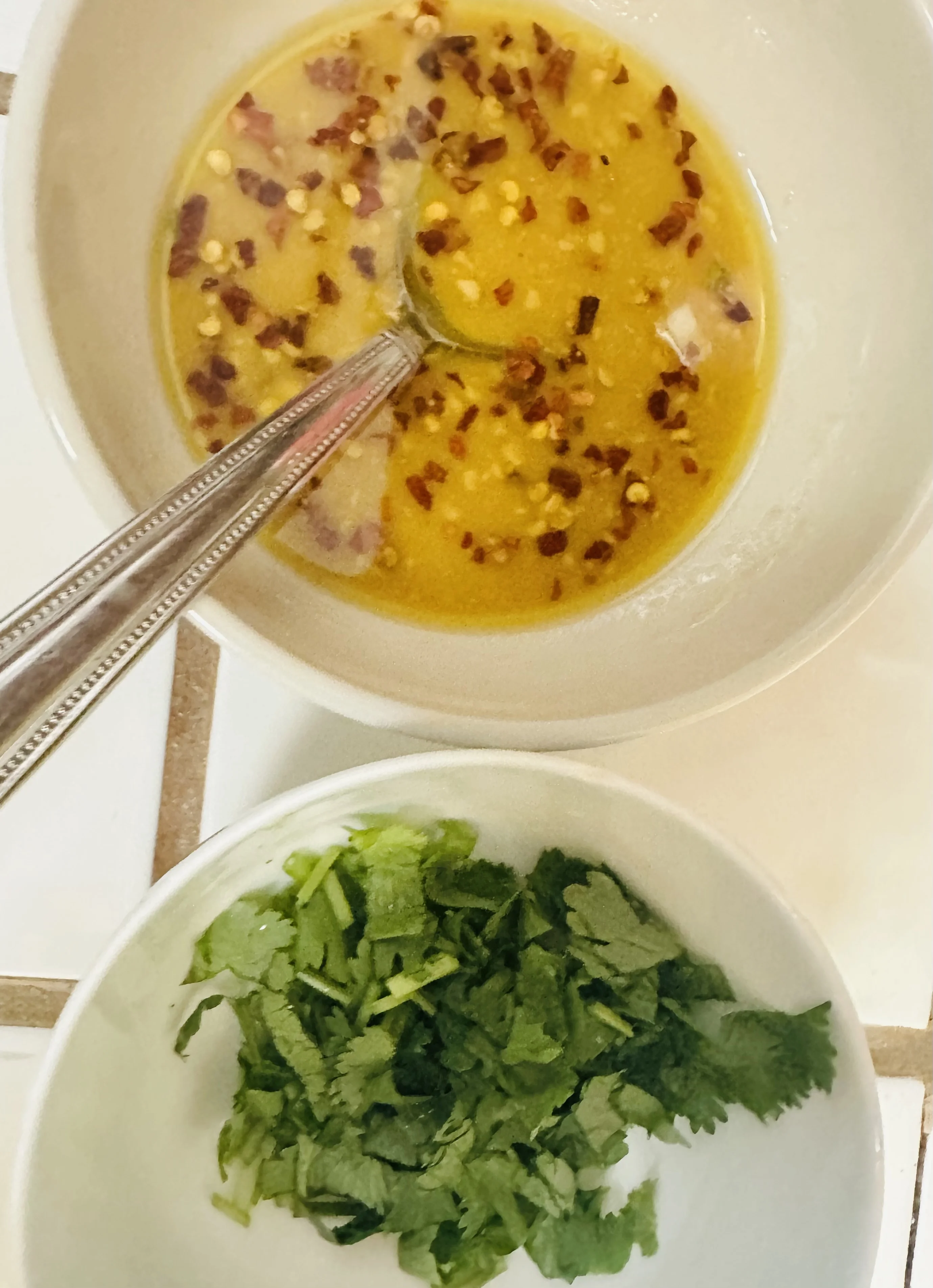 Hot honey sauce with red pepper flakes and fresh cilantro