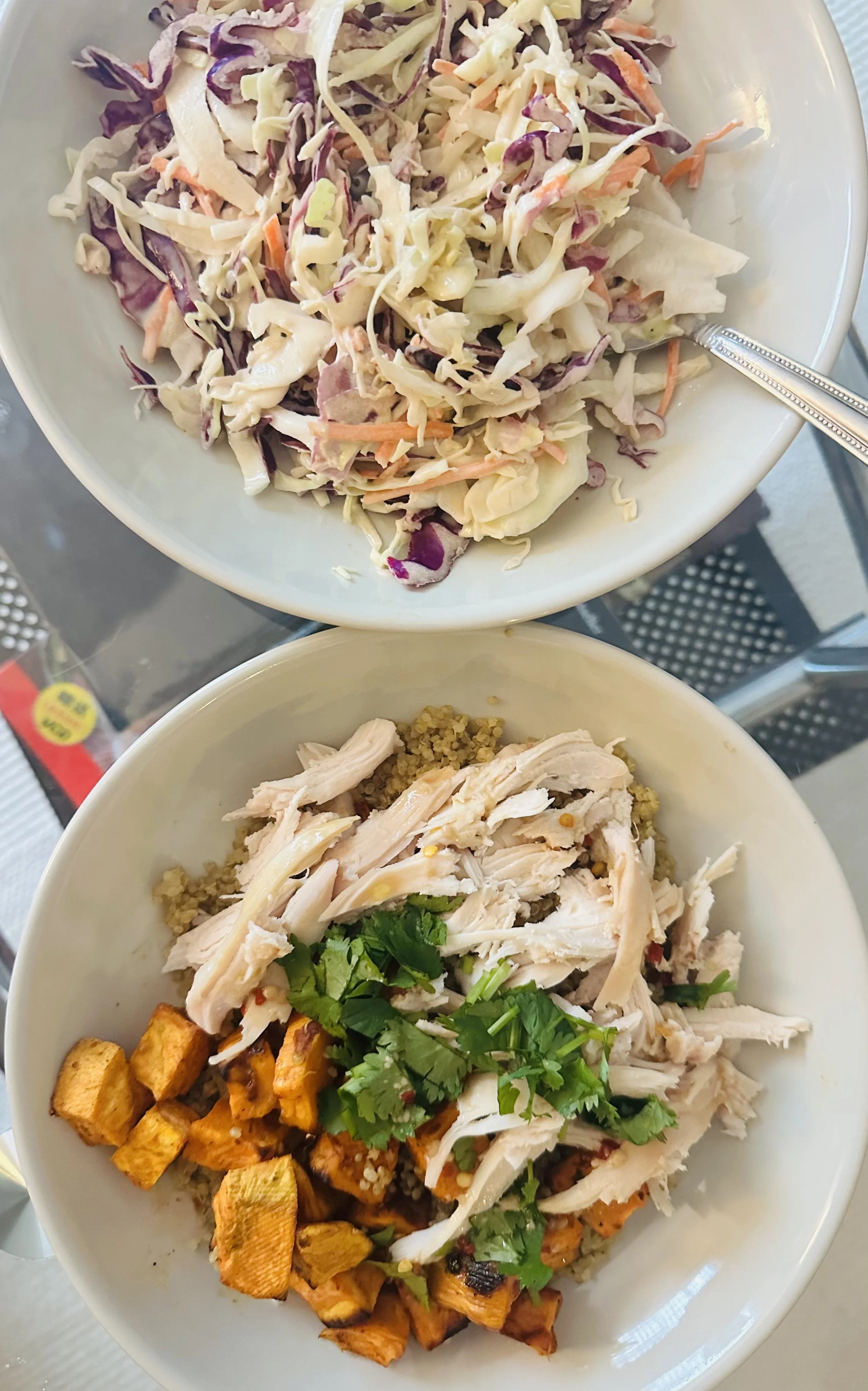 Cabbage slaw and assembled chicken salad bowl side by side